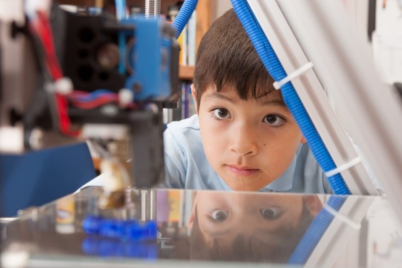 Child watching 3D Printer