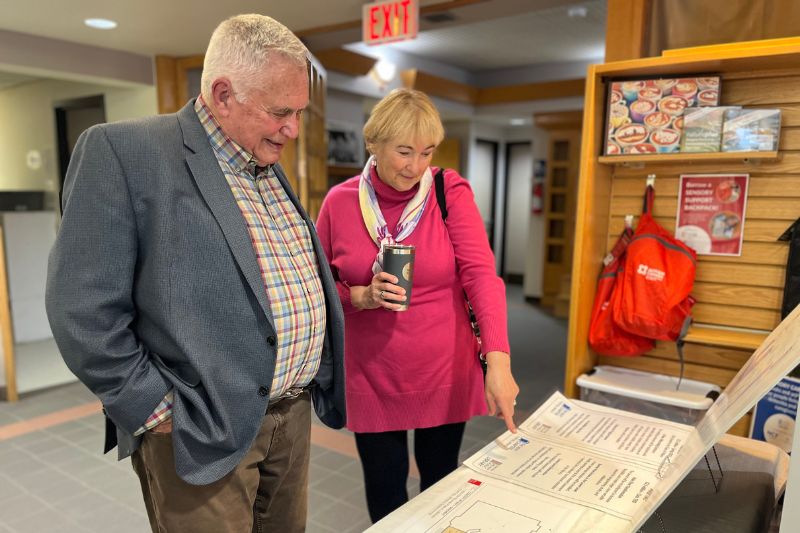Wayne Olson and Yvonne Van Lankveld looking at drawings of the Fonthill Renovation.